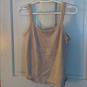 A tan tank top with lace